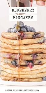Blueberry pancake stack with syrup pouring over.