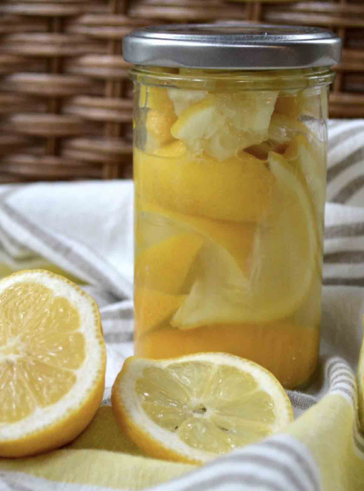 Jar of salted lemons preserved for use in recipes.