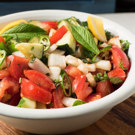 cucumber and tomato salad in bowl.