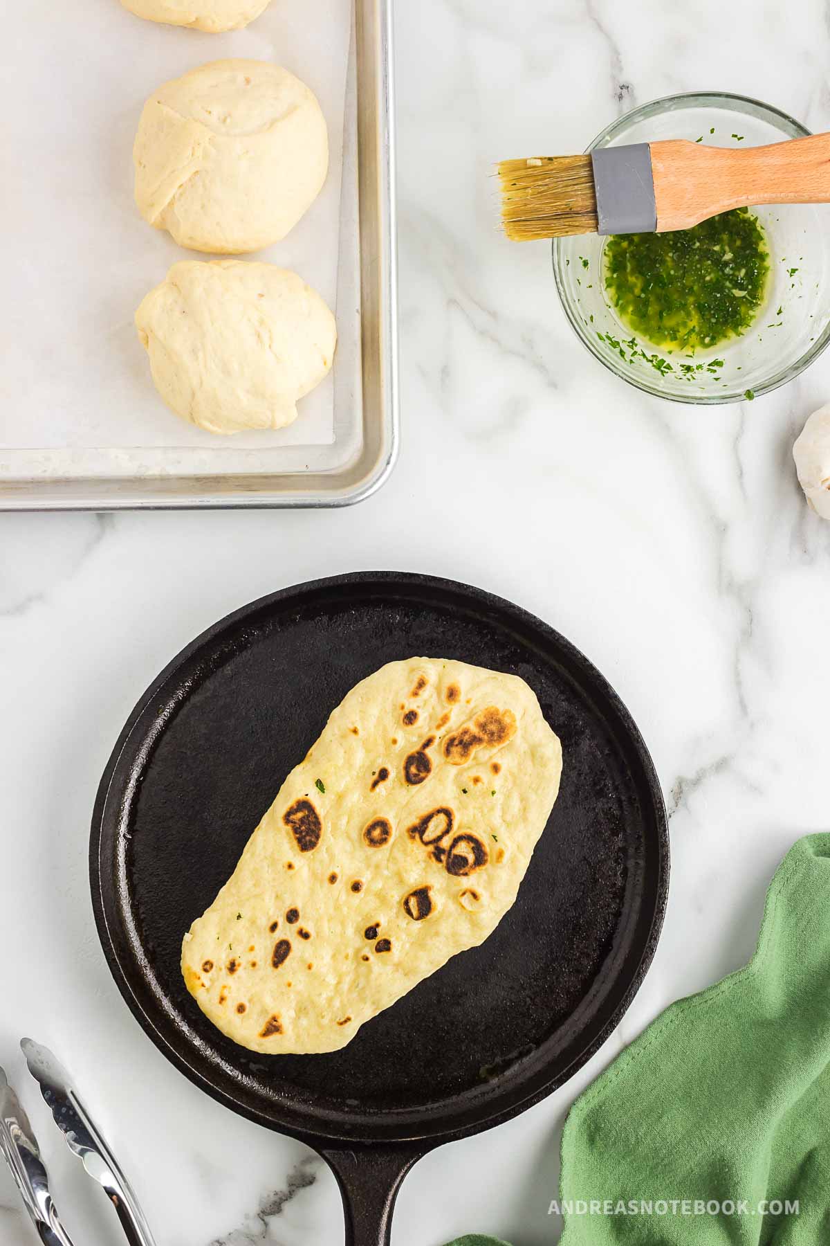 Cooked naan in skillet.