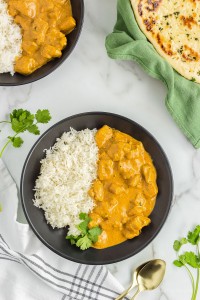 Plate of butter chicken and rice.