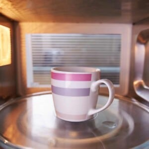 Mug in the microwave reheating coffee.