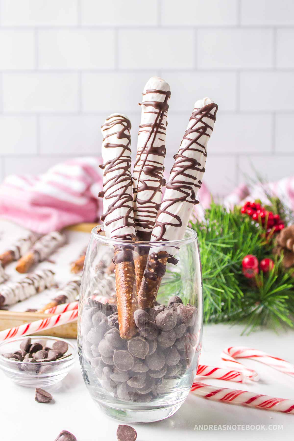 Christmas pretzel rods in a glass.