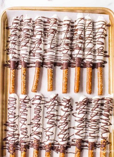 Sheet pan of mint chocolate covered pretzel rods.