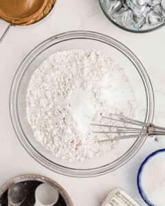 Dry ingredients in a large glass mixing bowl.