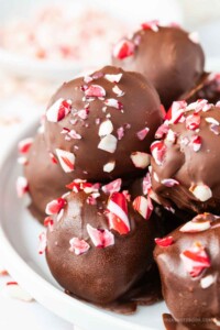 Plate of mint chocolate peppermint candy cane truffles.