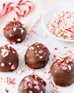Candy cane pieces on top of chocolate peppermint truffles.