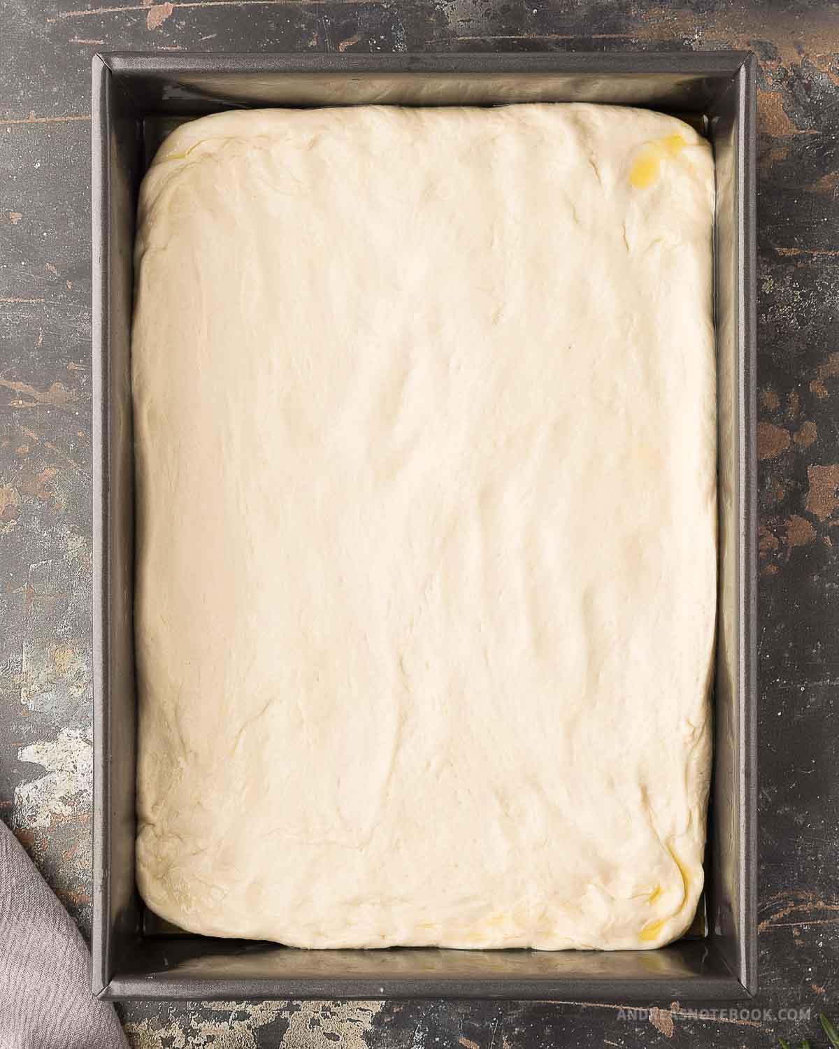 dough spread to cover bottom of baking dish.