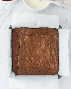 Baked brownies in a square pan.