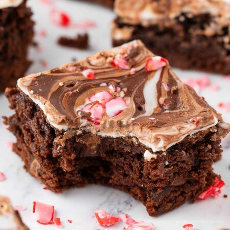 Bite out of a fudgy chocolate peppermint bark brownie.