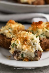 3 mushrooms stuffed with a crab cream cheese filling and topped with golden brown cheese.