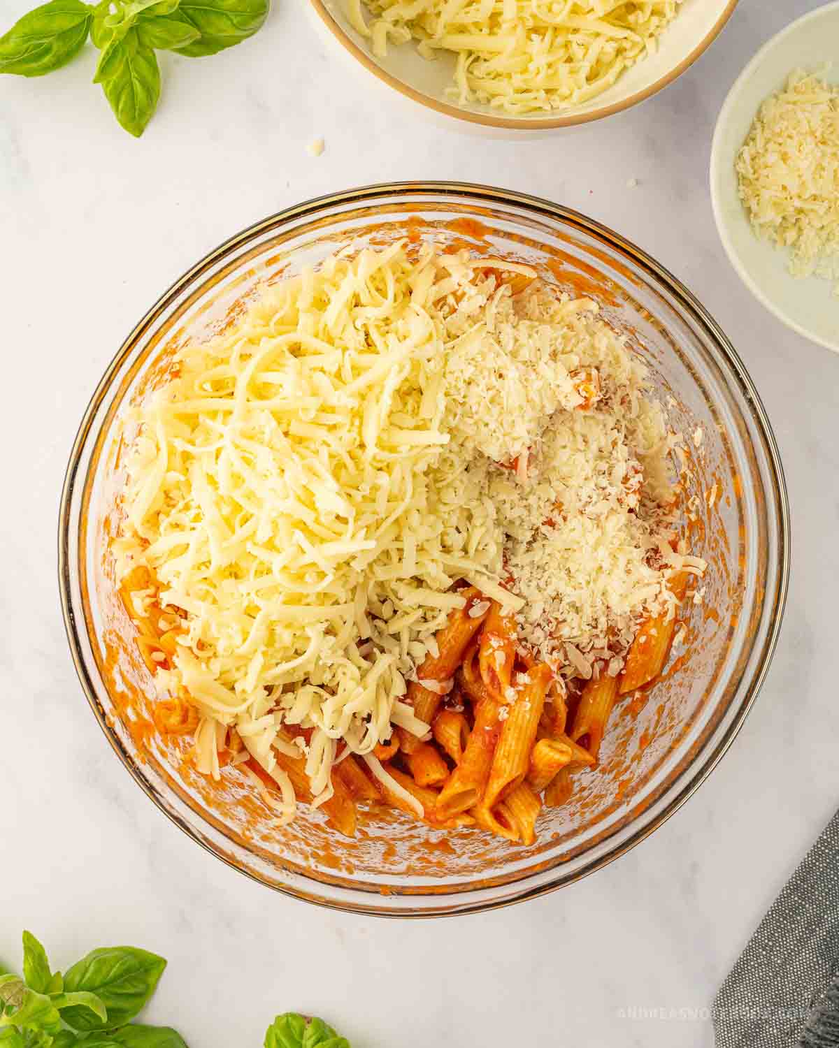Mozzarella cheese mixed with marinara and pasta.