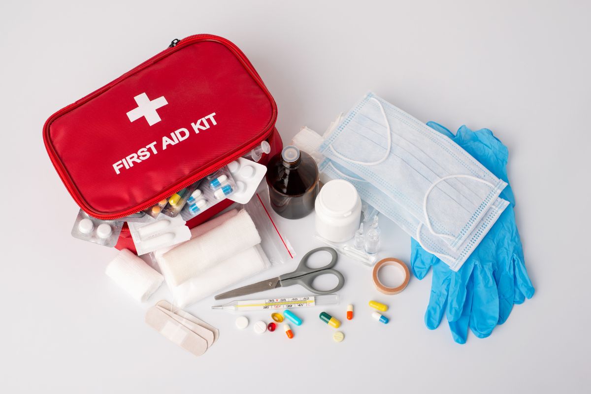 First aid kit with contents spilling out.