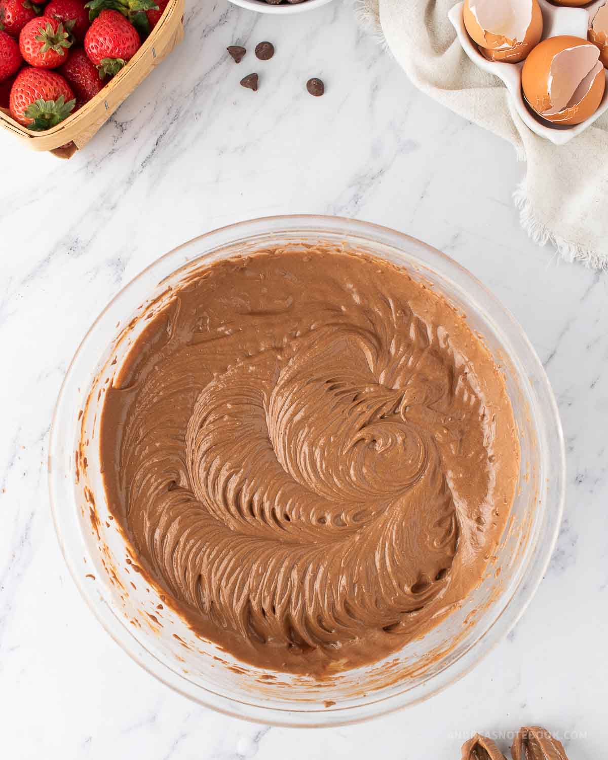 Brown chocolate cake batter in a large mixing bowl.
