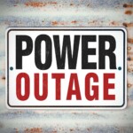 sign that says "power outage".