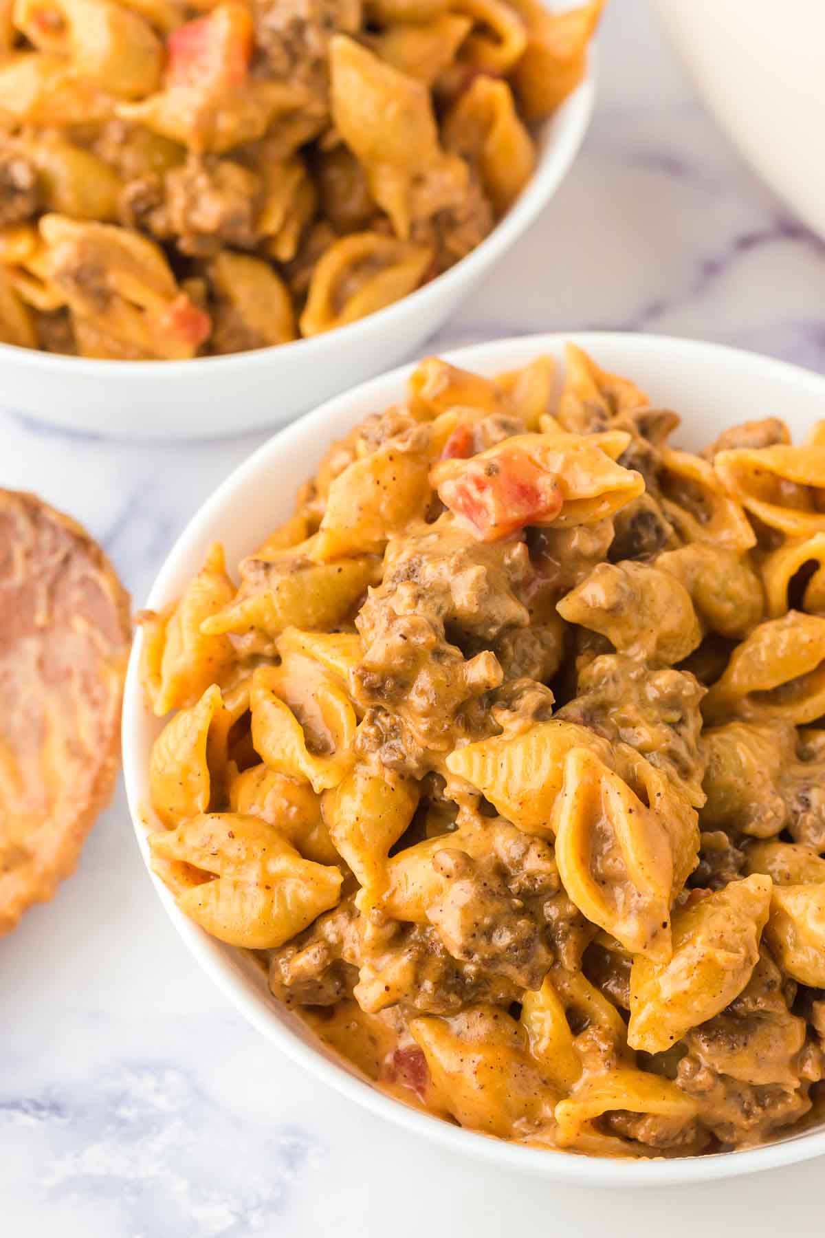 Two bowls of creamy taco pasta shells.